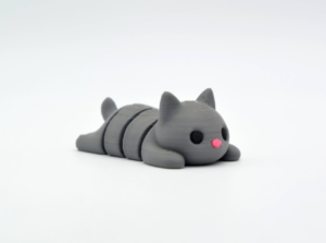 Cute gray cat toy lying down.